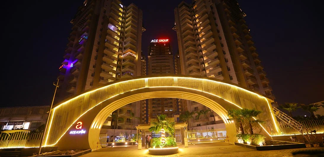 Entrance arch at ACE Aspire lit at night
