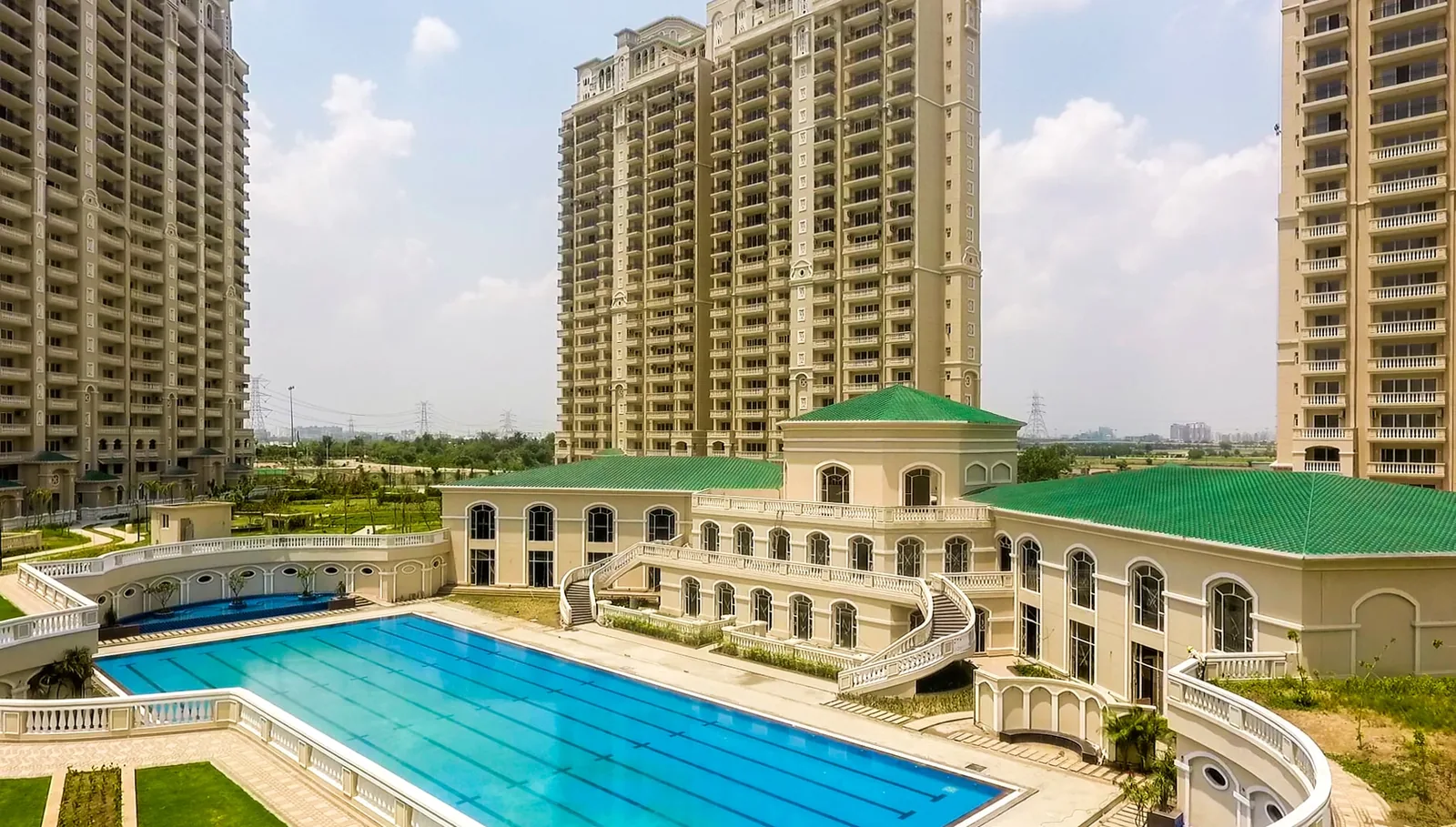 ATS Pristine clubhouse and swimming pool photographed from the air