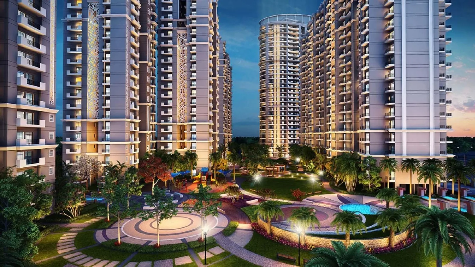 Samridhi Luxuriya Avenue towers above the lit central landscape at dusk